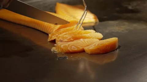 Cutting fresh salmon in a professional kitchen. Stock Footage 284607368