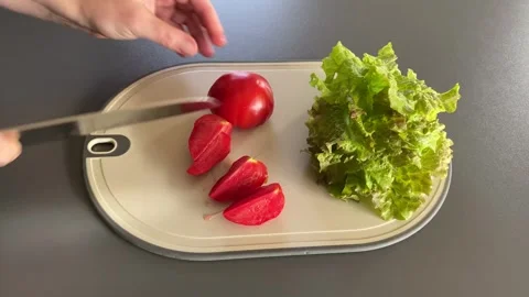 Cutting fresh veggies for a salad Stock Footage 343864207
