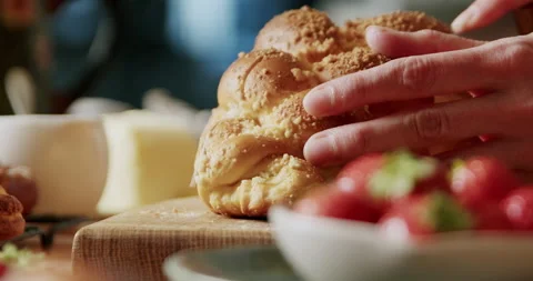 Cutting freshly baked bread, close-up in 4K. Stock Footage 221569004