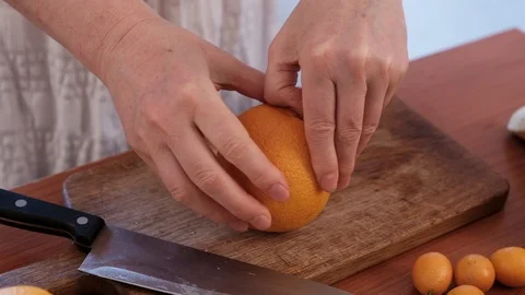 Cutting fruit on the kitchen table. Stock Footage 89120960
