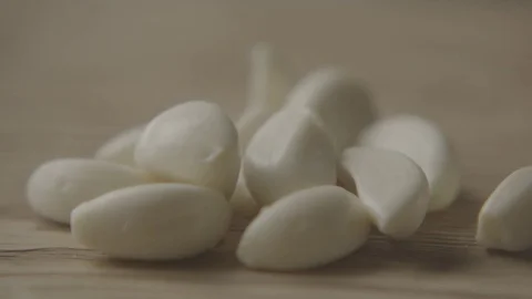 Cutting Garlic On Chopping Board In Slowmotion Stock Footage 84058962