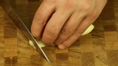 Cutting garlic cloves Stock Footage 50100740