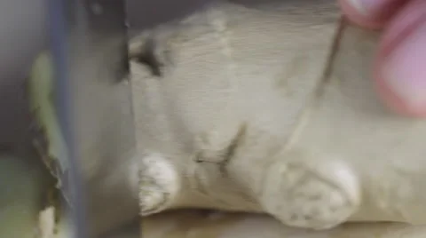 Cutting ginger with a knife. Macro shot. Видео 59913082