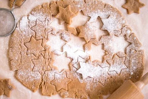 Cutting gingerbread cookies. Process of baking cookies at home. Stock Photos