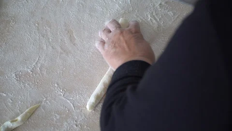 Cutting gnocchi pasta side high view Stock Footage 128988190