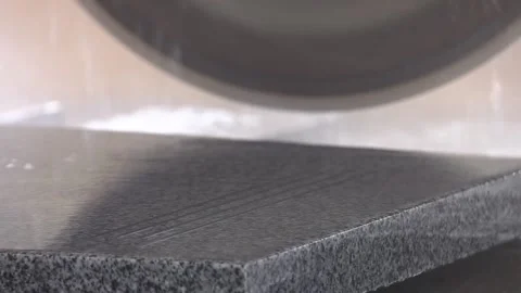 Cutting granite slab with a circular saw.  Wet granite saw, cutting moment. Stock-Footage 111244323