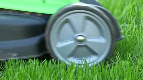 Cutting grass with mower Stock Footage 18185608