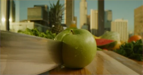 Cutting green apple macro shot, sliding over cooking table Stock Footage 126301830