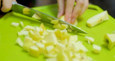 Cutting green apple on table Stock Footage 129426422