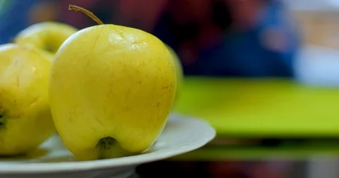 Cutting green apple on table Stock Footage 129426440