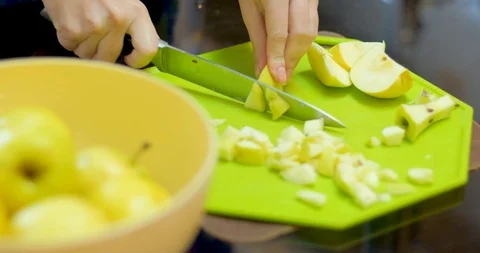 Cutting green apple on table Stock Footage 129426443