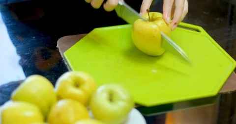Cutting green apple on table Stock Footage 129426477