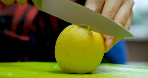 Cutting green apple on table Stock Footage 129426514