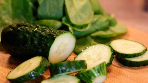 Cutting of a green cucumber Stock Footage 81950969