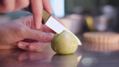 Cutting a green fig Stock Footage 138551005
