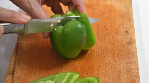 Cutting green pepper, on a table Stock Footage 219720282
