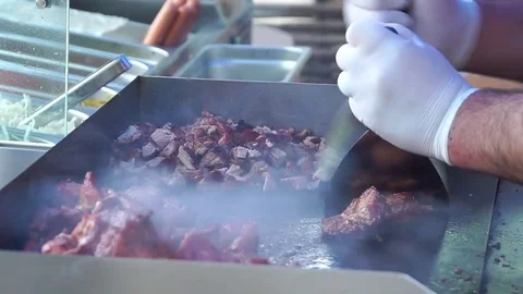 Cutting grilled meat. Stock Footage 75563195