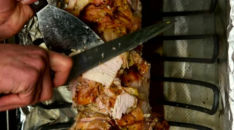Cutting grilled meat for making a traditional kebab Stock-Footage 59185556