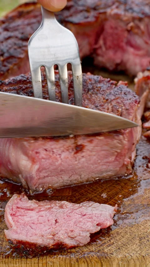 Cutting a grilled steak Stock Footage 315238843