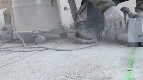 Cutting grooves in the concrete floor for installing underfloor heating Stock Footage 222792068