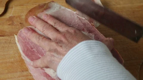 Cutting a ham into slices Stock Footage 108795703