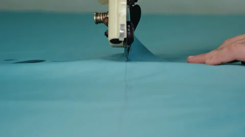 Cutting Heavy Fabrics on Weaving Table. Rotating Saw Blade. Cutting Machine Stock Footage 146107113