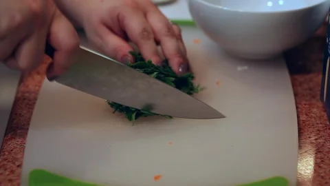 Cutting Herbs on White Cutting Board Stock Footage 94842267