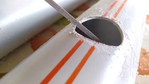 Cutting hole on water pipe, lo01 Stock Footage 131615565