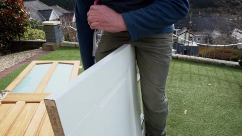 Cutting holes for the door internal hinge wood chisel cutting out groove Stock Footage 178043139