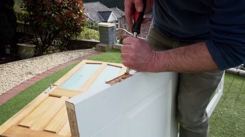 Cutting holes for the door internal hinge wood chisel cutting out groove Video stock 178050898