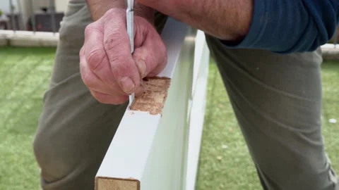 Cutting holes for the door internal hinge wood chisel cutting out groove Stock Footage 178051747