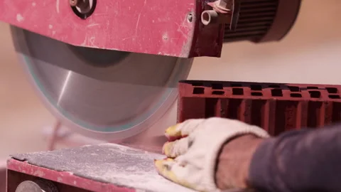 Cutting hollow ceramic brick with masonry saw close up Stock Footage 341987379