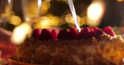 Cutting homemade raspberry cake for Christmas Stock Footage 314949337