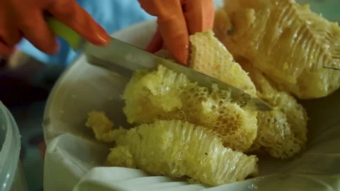 Cutting honeycomb Stock Footage 205467344