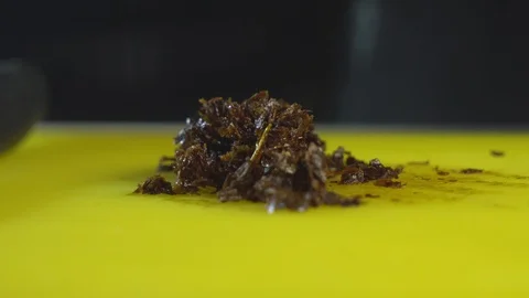 Cutting hookah tobacco on table Stock Footage 102532886