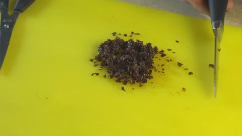 Cutting hookah tobacco on table Stock Footage 102533037
