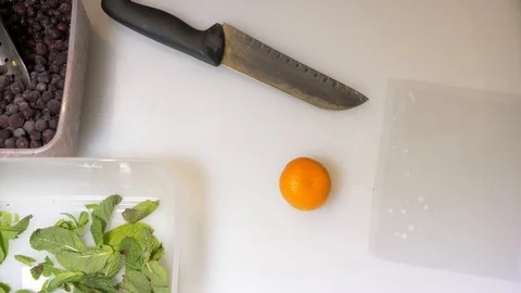 Cutting the ingredients for a cocktail Stock Footage 130050449