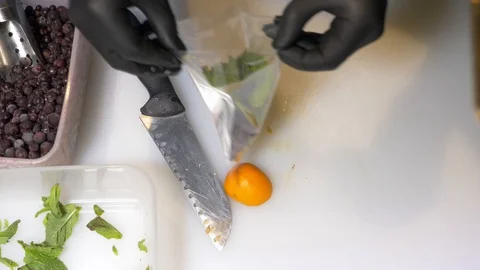 Cutting the ingredients for a cocktail Stock Footage 130050497