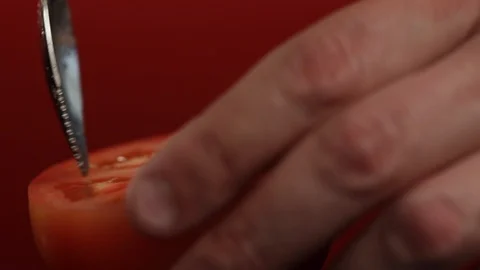 Cutting the Inside of a Tomato Stock Footage 86132148