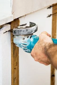 Cutting Insulation with Grinder Stock Photos