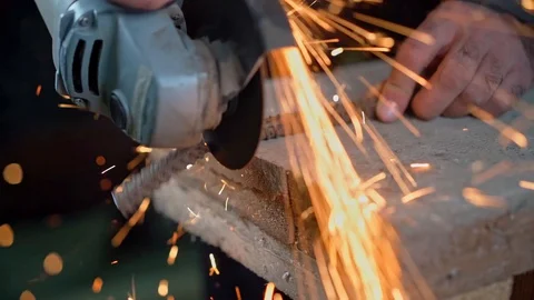 Cutting an iron bar with a sander Stock Footage 129517142