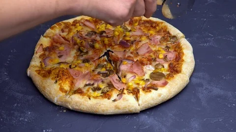 Cutting Italian pizza on the table Stock Footage 113347754