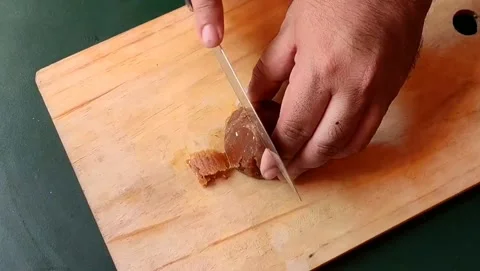 Cutting jaggery Stock Footage 203902068