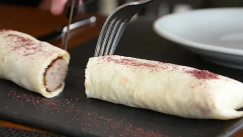 Cutting  kebab with knife and fork Stock Footage 135378554
