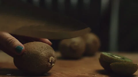 Cutting a kiwi Stock Footage 52518388