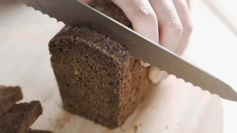 Cutting with a Knife Crusty Artisan Bread in the Kitchen 動画素材 149030259
