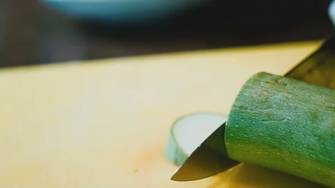 Cutting knife zucchini into slices Stock Footage 73216693