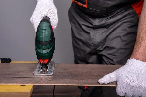 Cutting the laminate Stock Photos