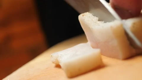 Cutting lard with a knife Stock Footage 143976227