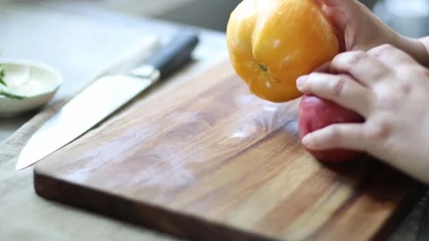 Cutting large fresh tomatoes, 4k, home kitchen Stock Footage 248542283